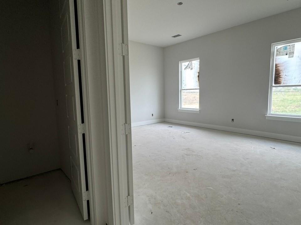 2305 Quartz Street Krum, TX 76249 - Photo 13 of 18 a view of empty room with windows