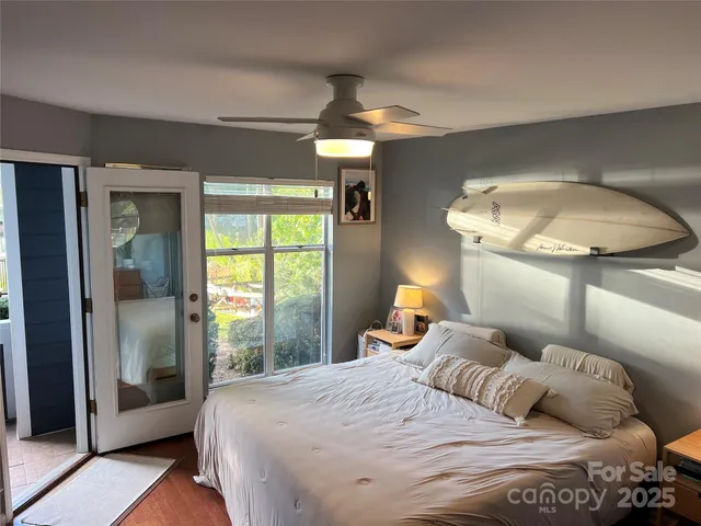 a bedroom with a bed and a mirror