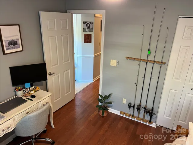 a bedroom with furniture and a window