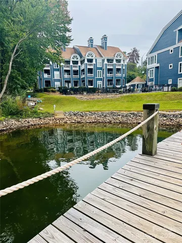 a view of swimming pool with outdoor seating and yard