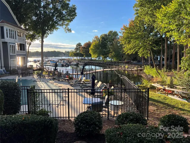 a view of a balcony with iron fence