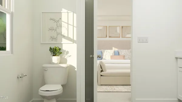 a bathroom with a toilet a sink and a window