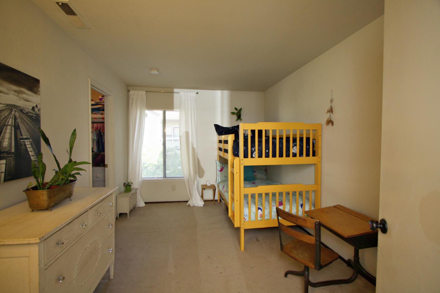111 Bean Creek Road, Unit 26 Scotts Valley, CA 95066 - Photo 14 of 28 a bedroom with furniture and a window