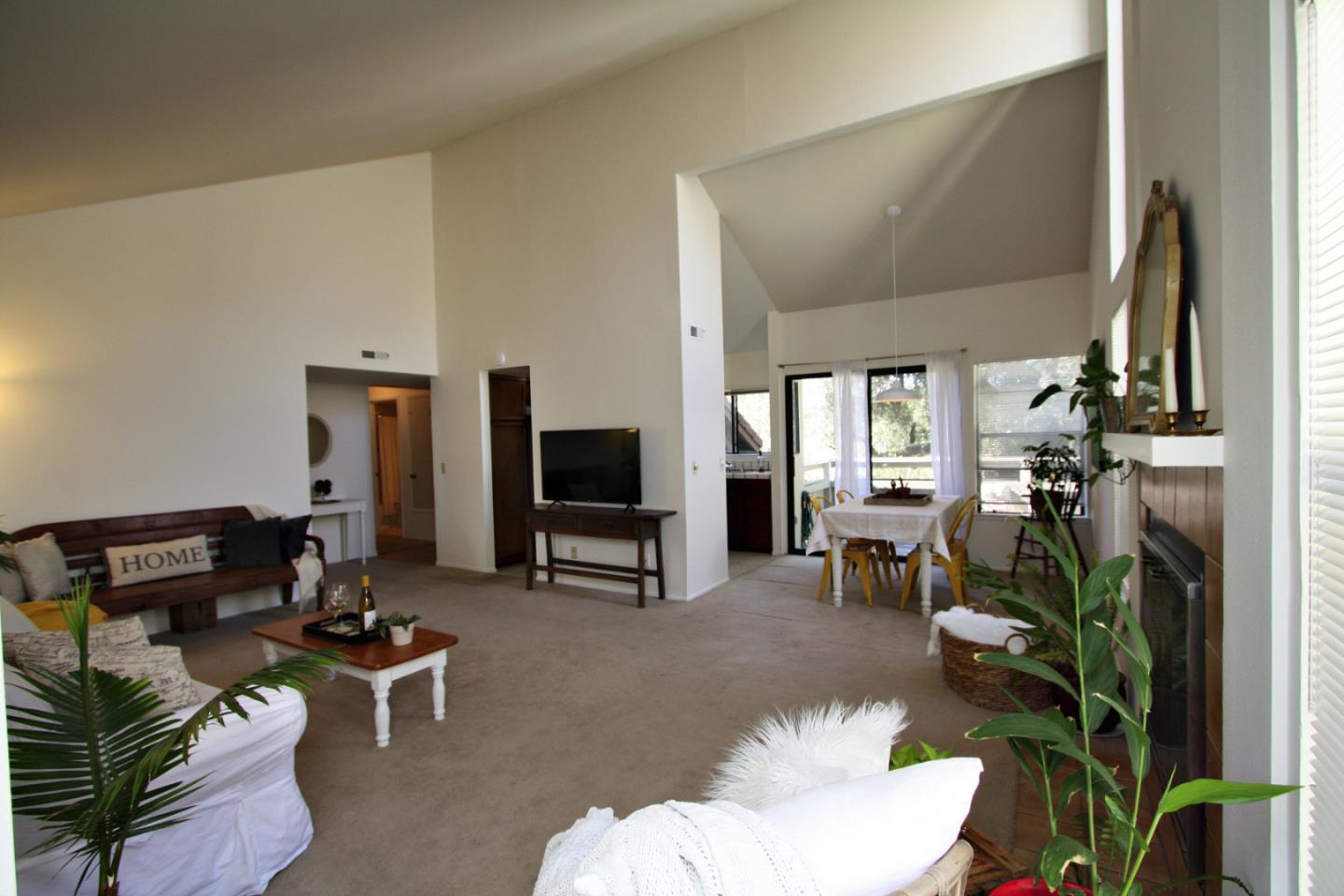 111 Bean Creek Road, Unit 26 Scotts Valley, CA 95066 - Photo 22 of 28 a living room with furniture a flat screen tv and a large window