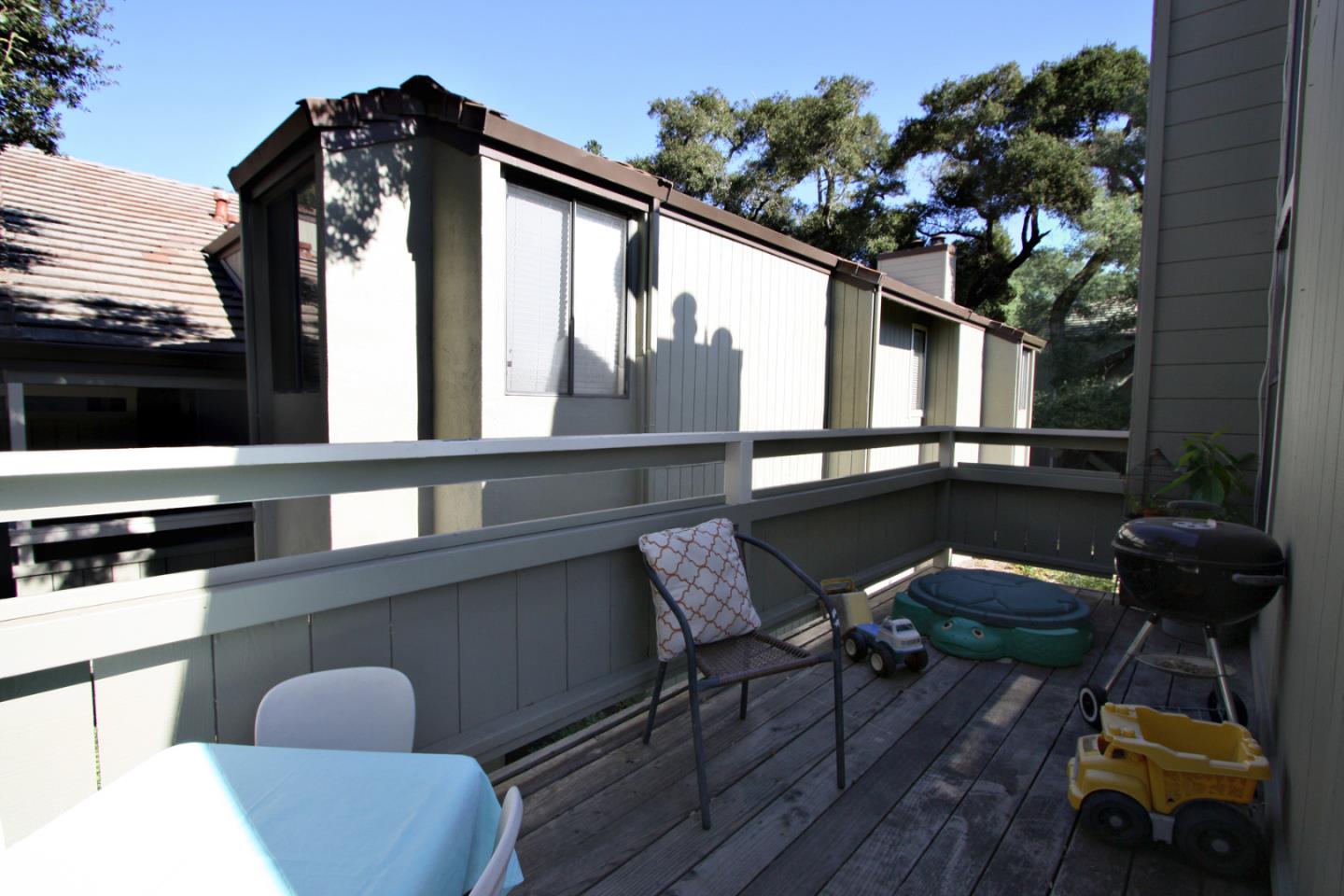 111 Bean Creek Road, Unit 26 Scotts Valley, CA 95066 - Photo 24 of 28 a view of a chairs and table in the back yard of the house