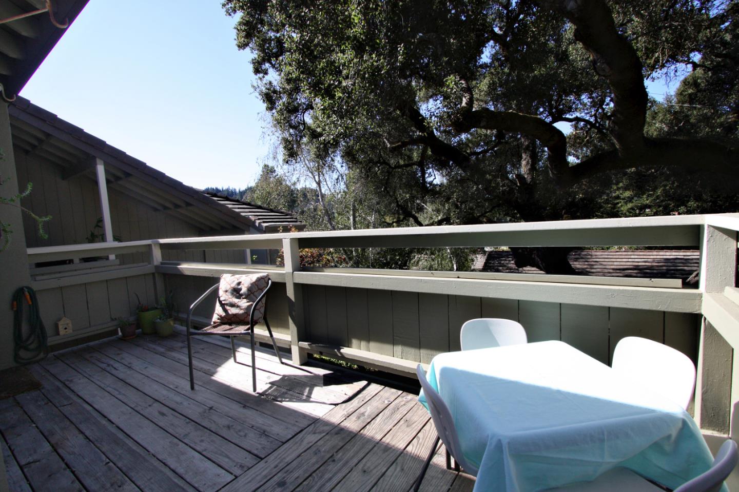 111 Bean Creek Road, Unit 26 Scotts Valley, CA 95066 - Photo 25 of 28 a balcony with wooden floor and furniture