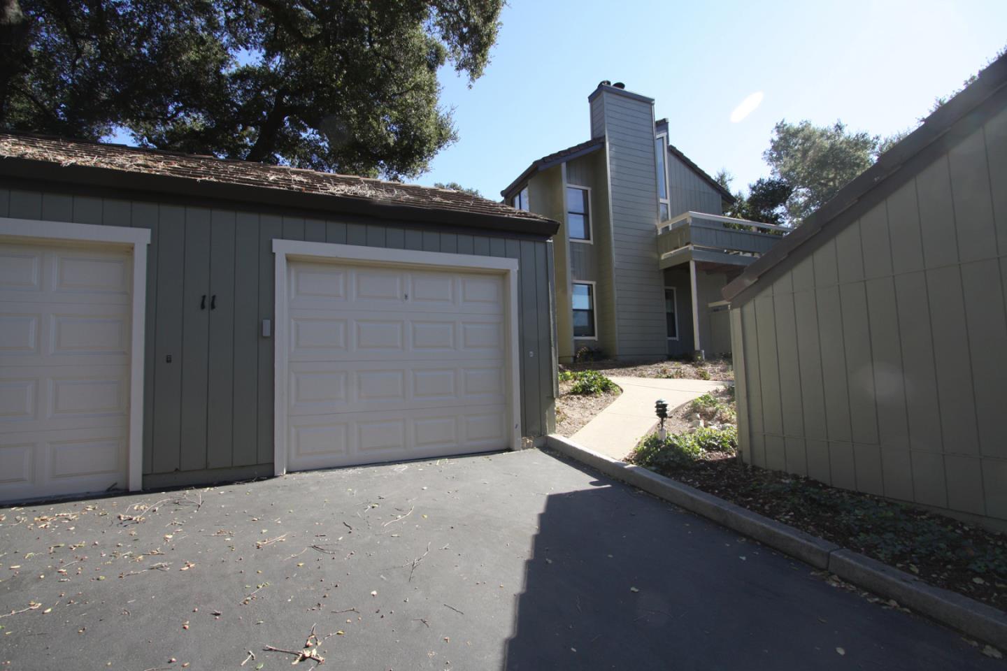 111 Bean Creek Road, Unit 26 Scotts Valley, CA 95066 - Photo 26 of 28 a front view of a house with a yard and garage