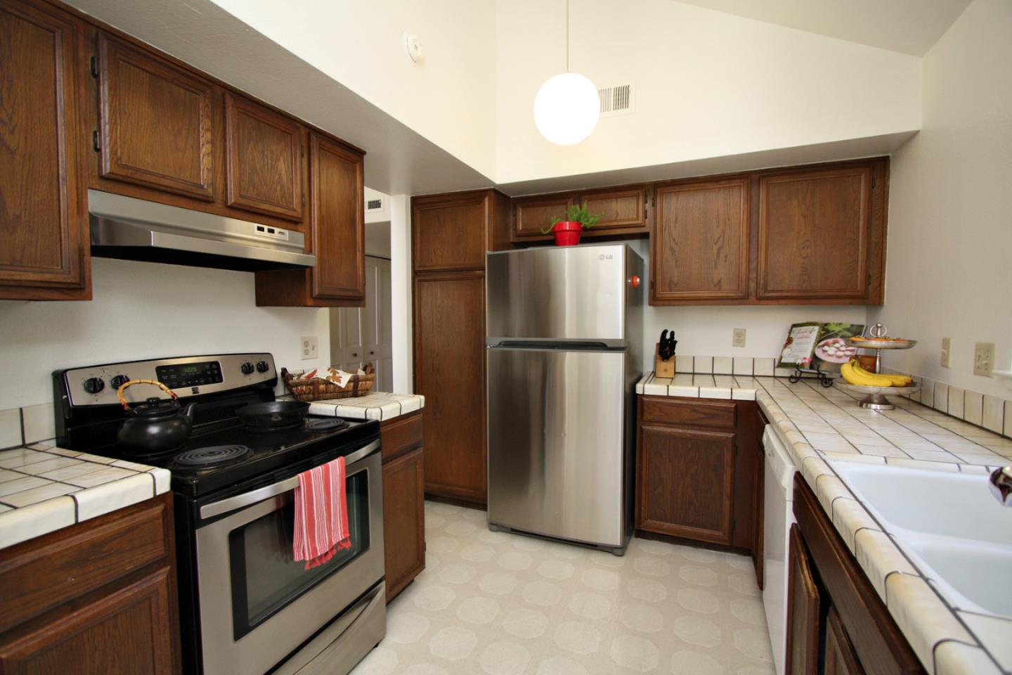 111 Bean Creek Road, Unit 26 Scotts Valley, CA 95066 - Photo 10 of 28 a kitchen with a refrigerator stove and sink