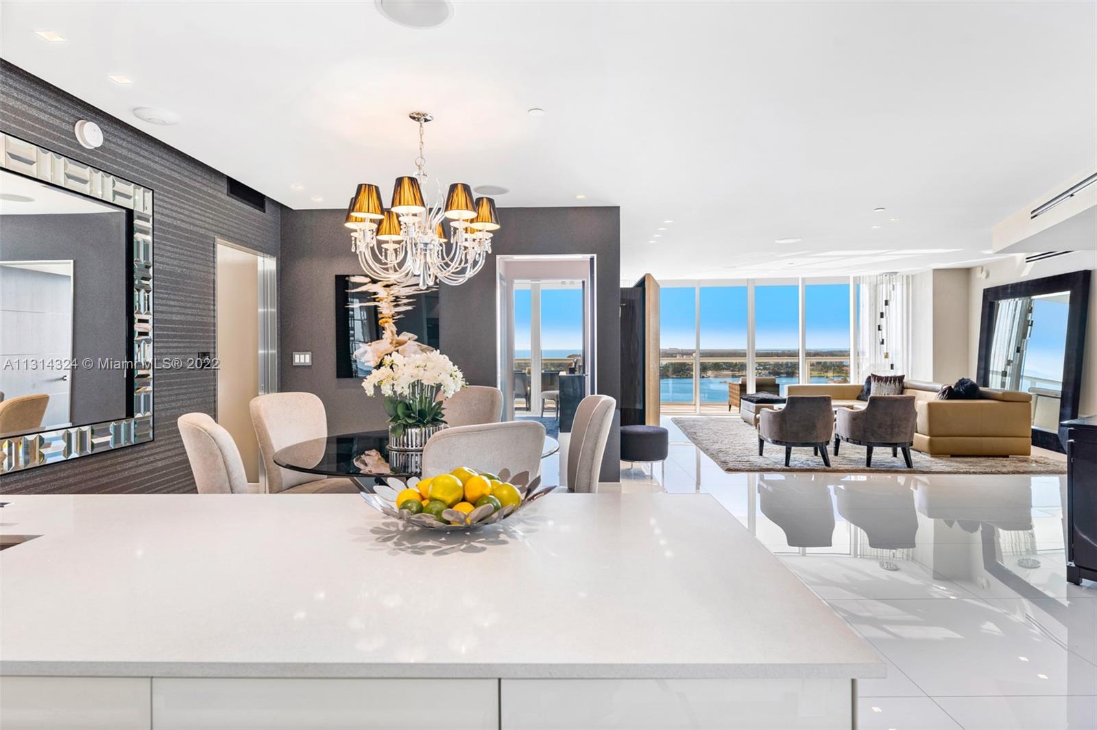 a living room with dining table and chairs