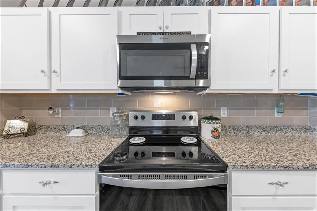 51 Dorsey Way Monroe, GA 30655 - Photo 20 of 54 a stove top oven sitting inside of a kitchen