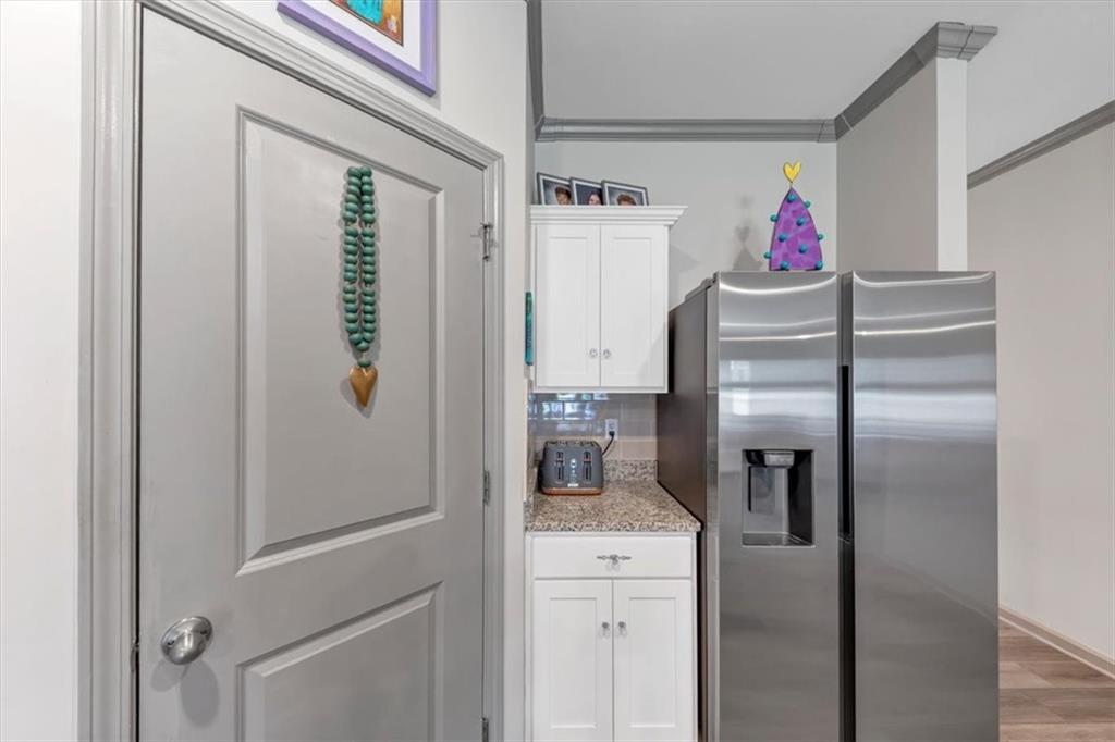 51 Dorsey Way Monroe, GA 30655 - Photo 21 of 54 a kitchen with a refrigerator and microwave