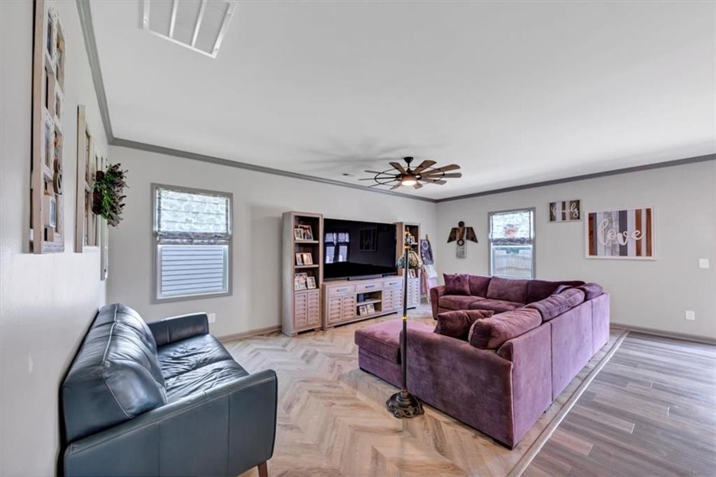 51 Dorsey Way Monroe, GA 30655 - Photo 22 of 54 a living room with furniture and a flat screen tv
