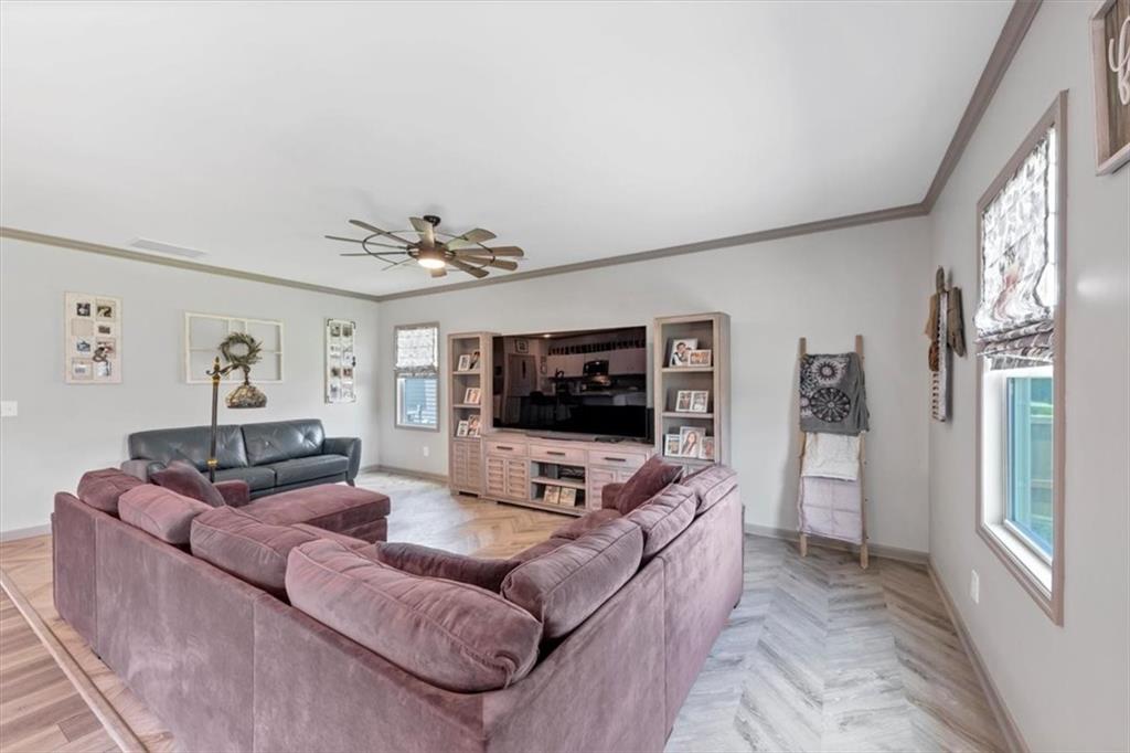 51 Dorsey Way Monroe, GA 30655 - Photo 23 of 54 a living room with furniture and a flat screen tv