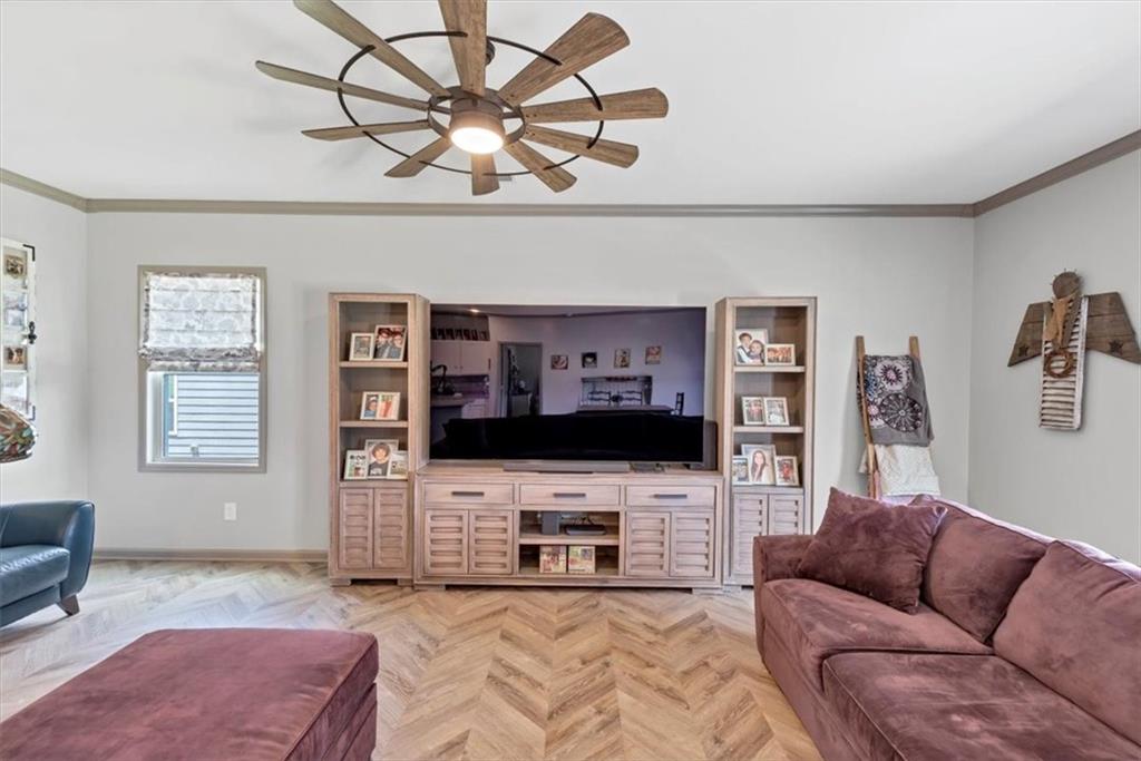51 Dorsey Way Monroe, GA 30655 - Photo 24 of 54 a living room with furniture a flat screen tv and a fireplace