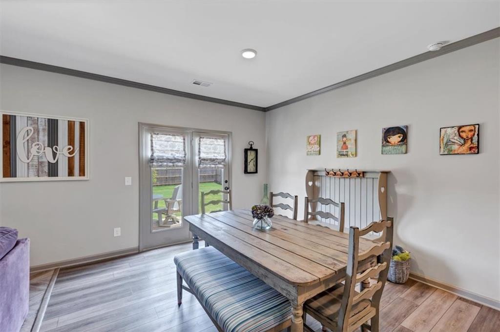 51 Dorsey Way Monroe, GA 30655 - Photo 27 of 54 a view of a dining room with furniture window and wooden floor