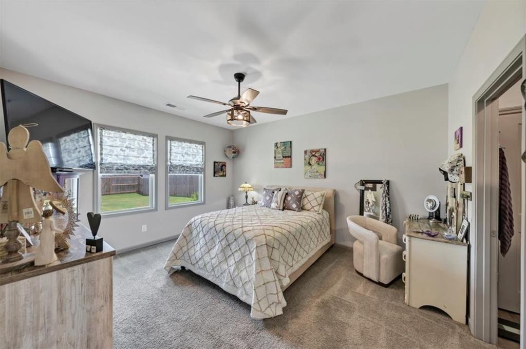 51 Dorsey Way Monroe, GA 30655 - Photo 29 of 54 a living room with a bed furniture and a large window