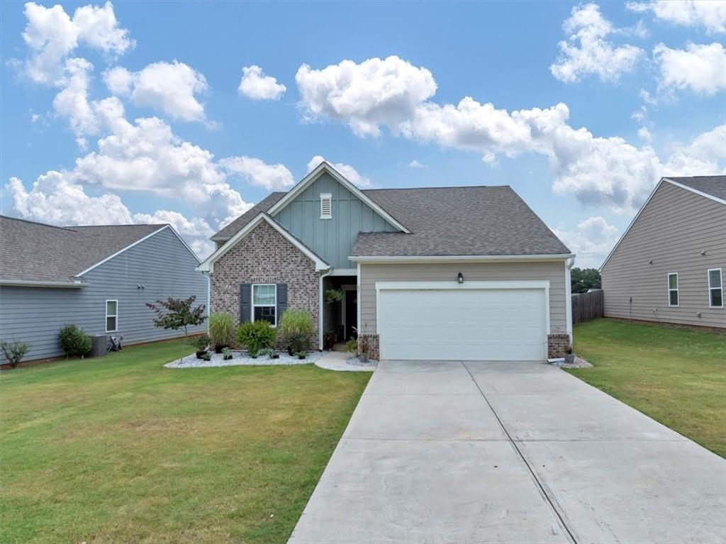 51 Dorsey Way Monroe, GA 30655 - Photo 3 of 54 a front view of house with yard and trees