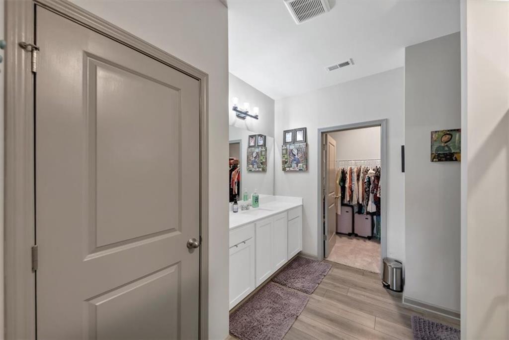 51 Dorsey Way Monroe, GA 30655 - Photo 33 of 54 a view of a hallway with bathroom and wooden floor