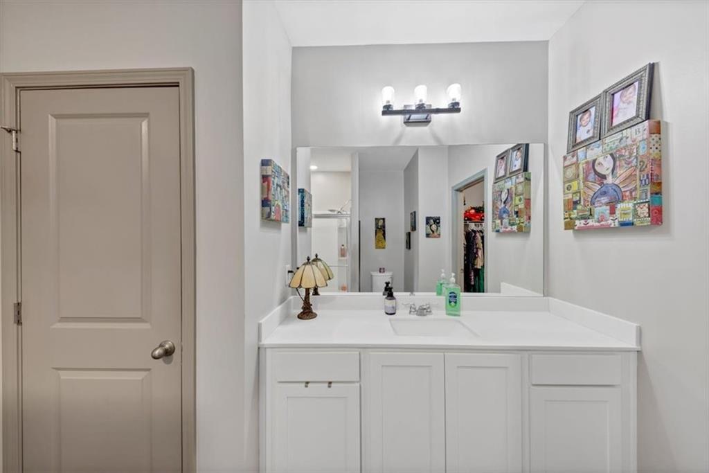 51 Dorsey Way Monroe, GA 30655 - Photo 34 of 54 a bathroom with a sink and a mirror