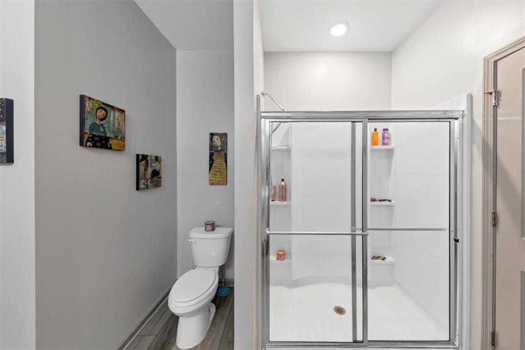 51 Dorsey Way Monroe, GA 30655 - Photo 35 of 54 a bathroom with a toilet and a shower