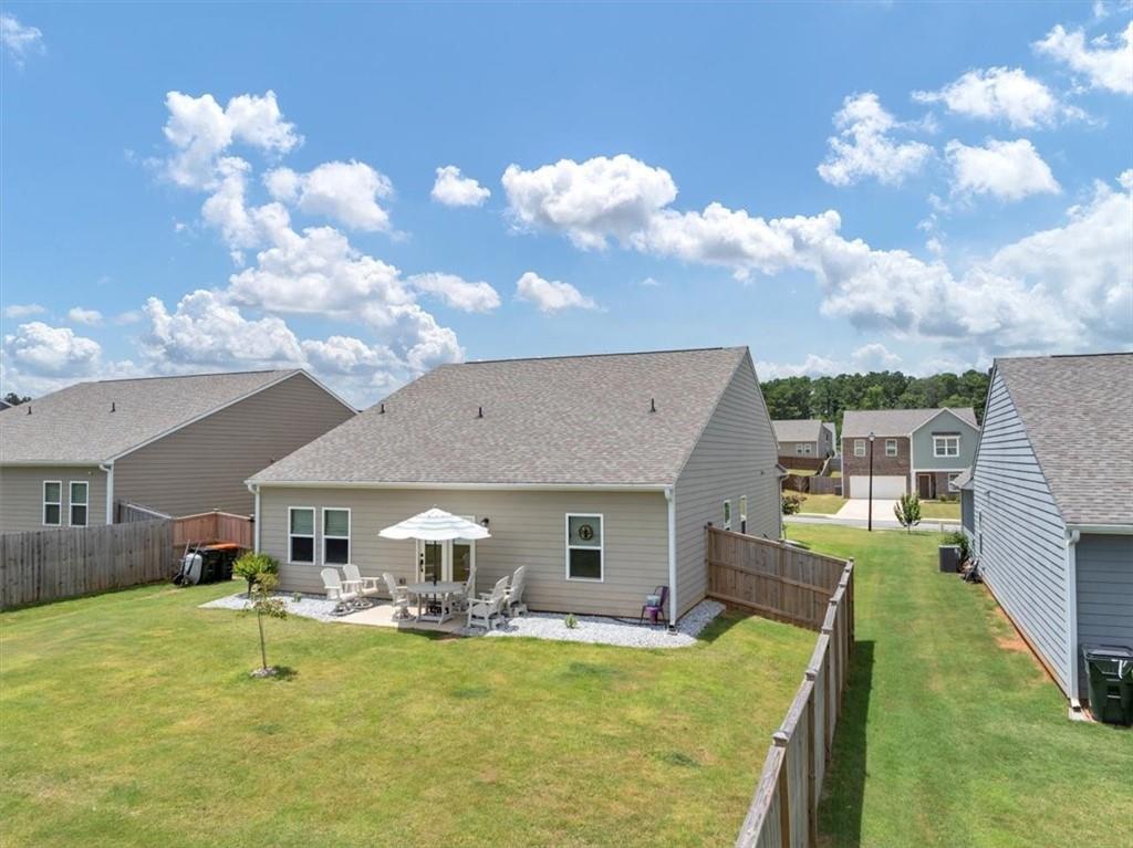 51 Dorsey Way Monroe, GA 30655 - Photo 39 of 54 a view of a house with swimming pool and a yard