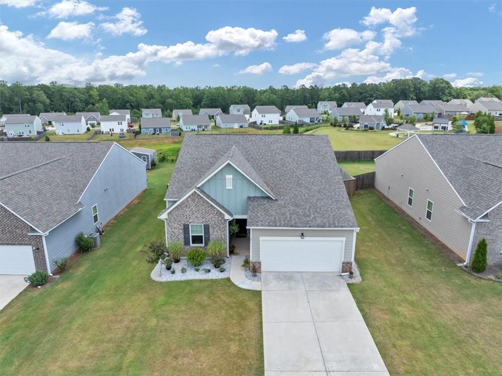 51 Dorsey Way Monroe, GA 30655 - Photo 43 of 54 a aerial view of a house with swimming pool and a yard
