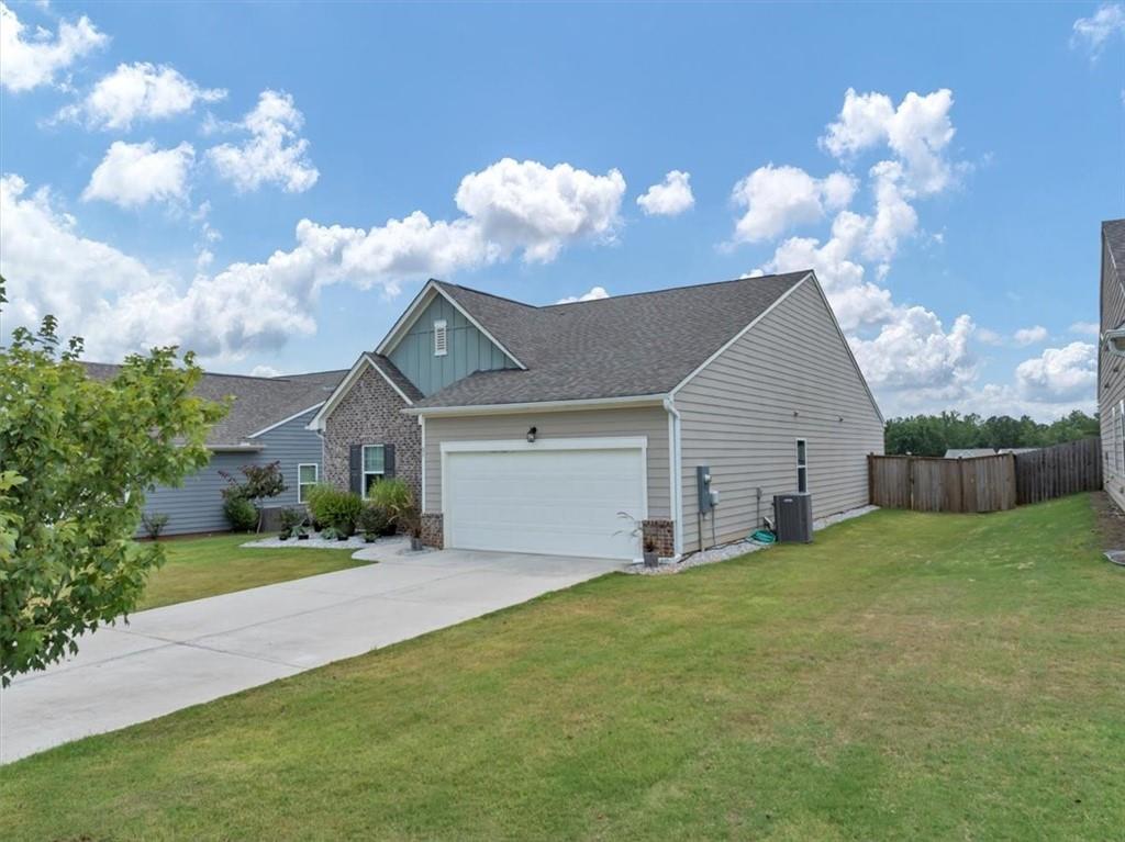 51 Dorsey Way Monroe, GA 30655 - Photo 5 of 54 a view of a house with a yard and garage