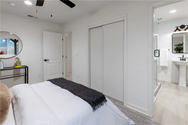 a bedroom with a bed and a view of bathroom