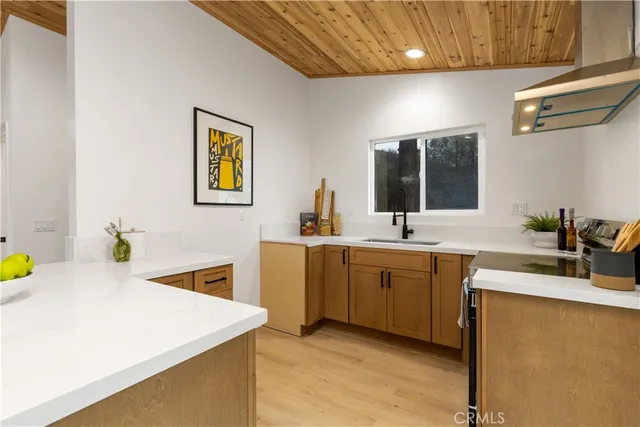 a kitchen with sink cabinets and appliances