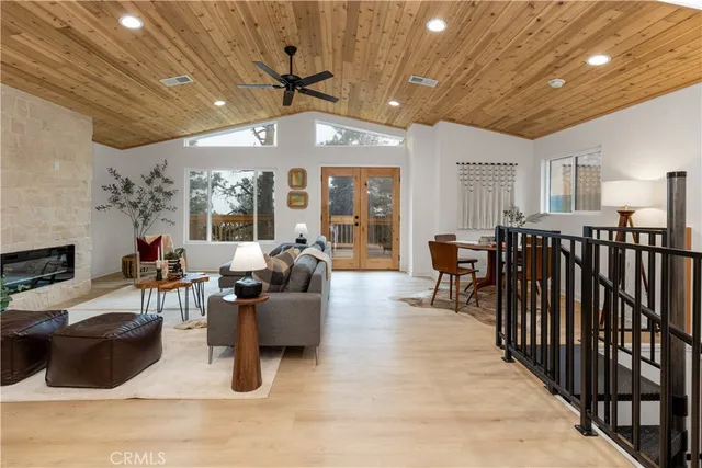 a living room with lots of furniture and a chandelier