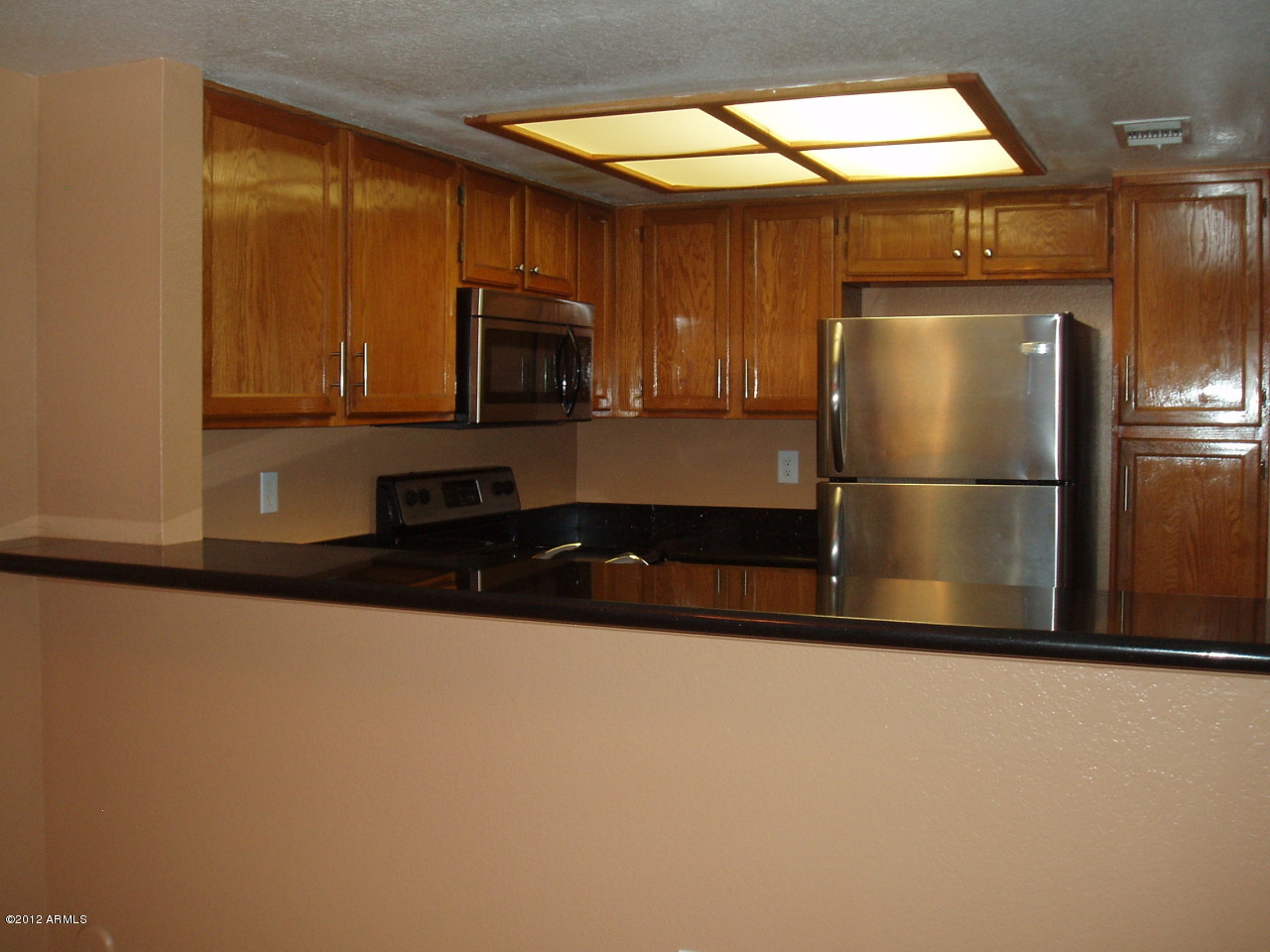 1645 West Baseline Road, Unit 1022 Mesa, AZ 85202 - Photo 11 of 23 Looking at Kitchen from Dining Area