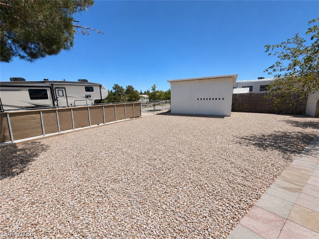 1611 West Blosser Ranch Road Pahrump, NV 89060 - Photo 15 of 25 A spacious, rock-covered lot offers ample parking and a secluded feel with natural fencing.