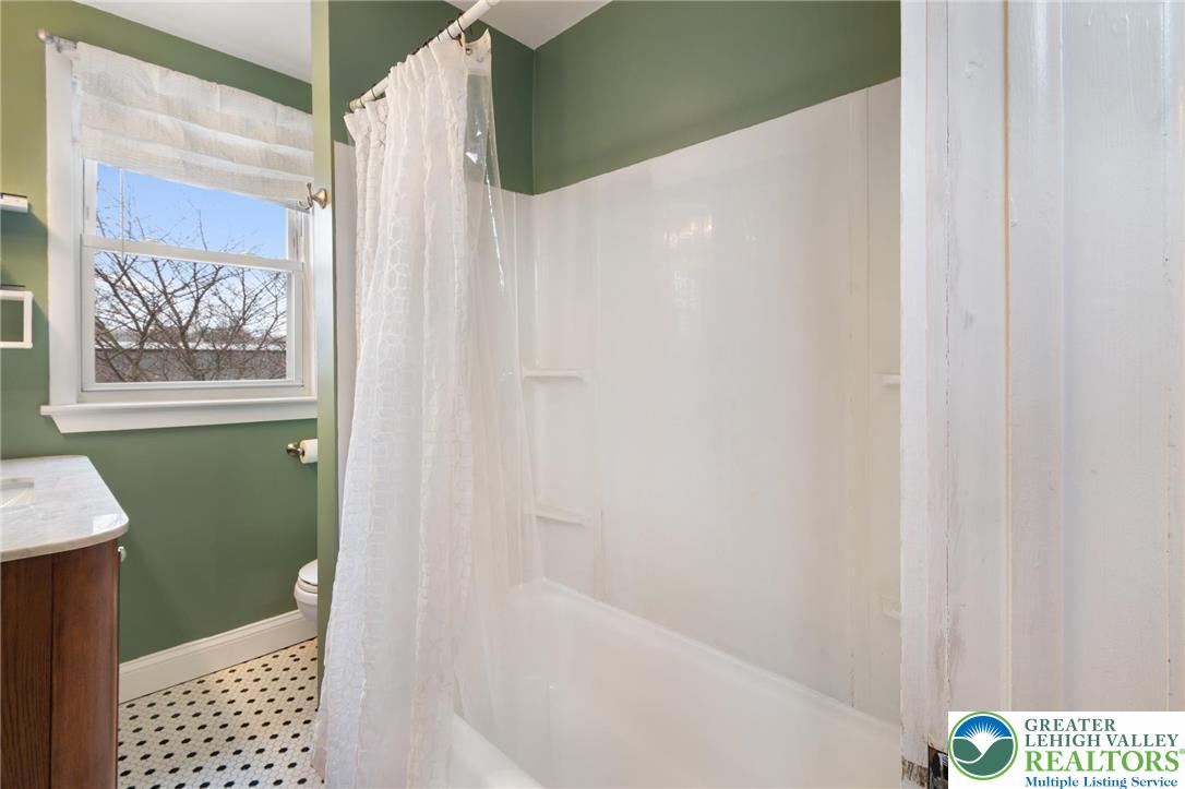 743 Front Street Hellertown, PA 18055 - Photo 13 of 28 a bathroom with a bathtub and a shower