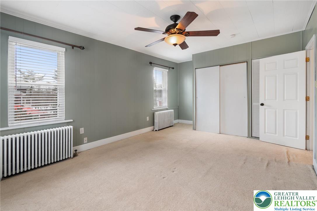 743 Front Street Hellertown, PA 18055 - Photo 16 of 28 a view of a livingroom with a ceiling fan and window