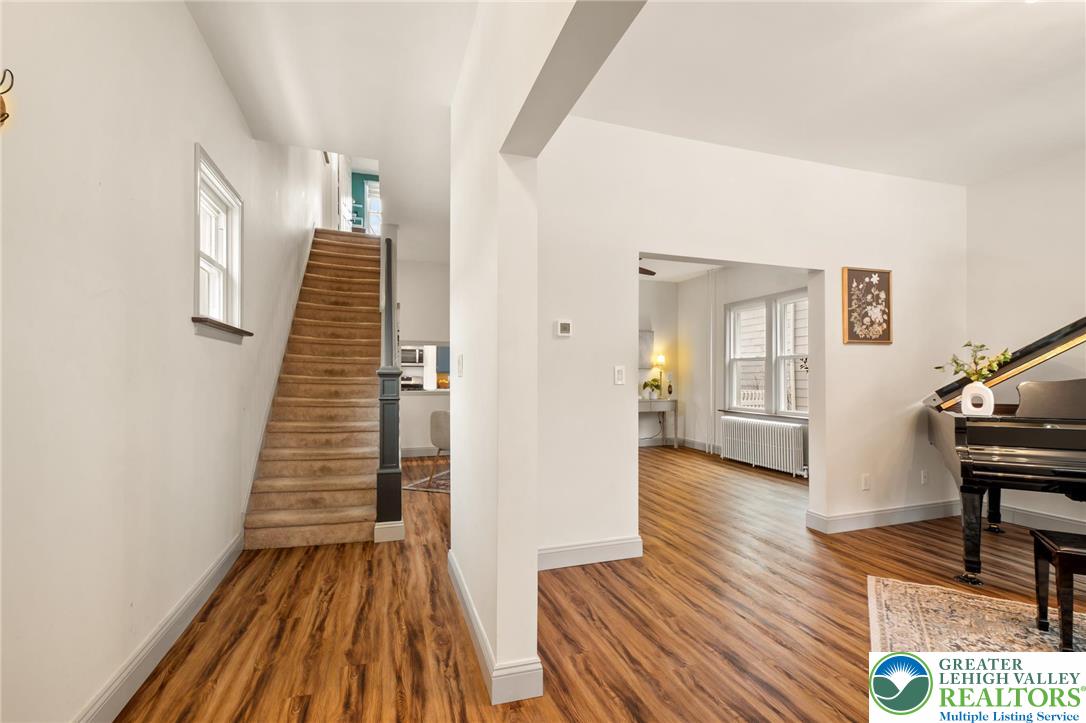 743 Front Street Hellertown, PA 18055 - Photo 2 of 28 a view of a room with wooden floor and stairs