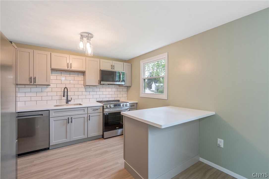 114 Saltwell Road Salina, NY 13090 - Photo 8 of 27 The addition of a breakfast bar in between the kitchen and dining areas is a great option for meals on the run, or maybe homework in the evening (as well as keeping guests out of the way for the chef to do their thing!).