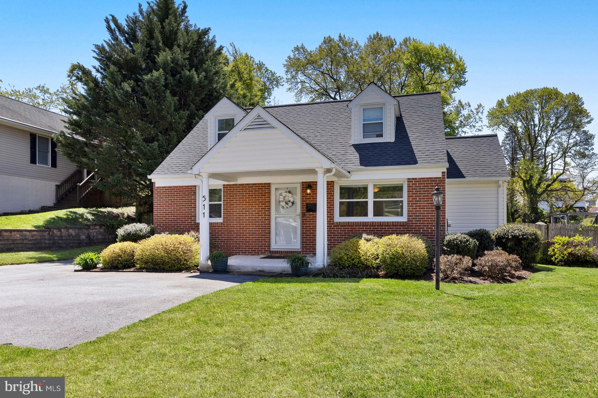 511 Greenwood Road Linthicum Heights, MD 21090 - Photo 1 of 26 a front view of a house with garden