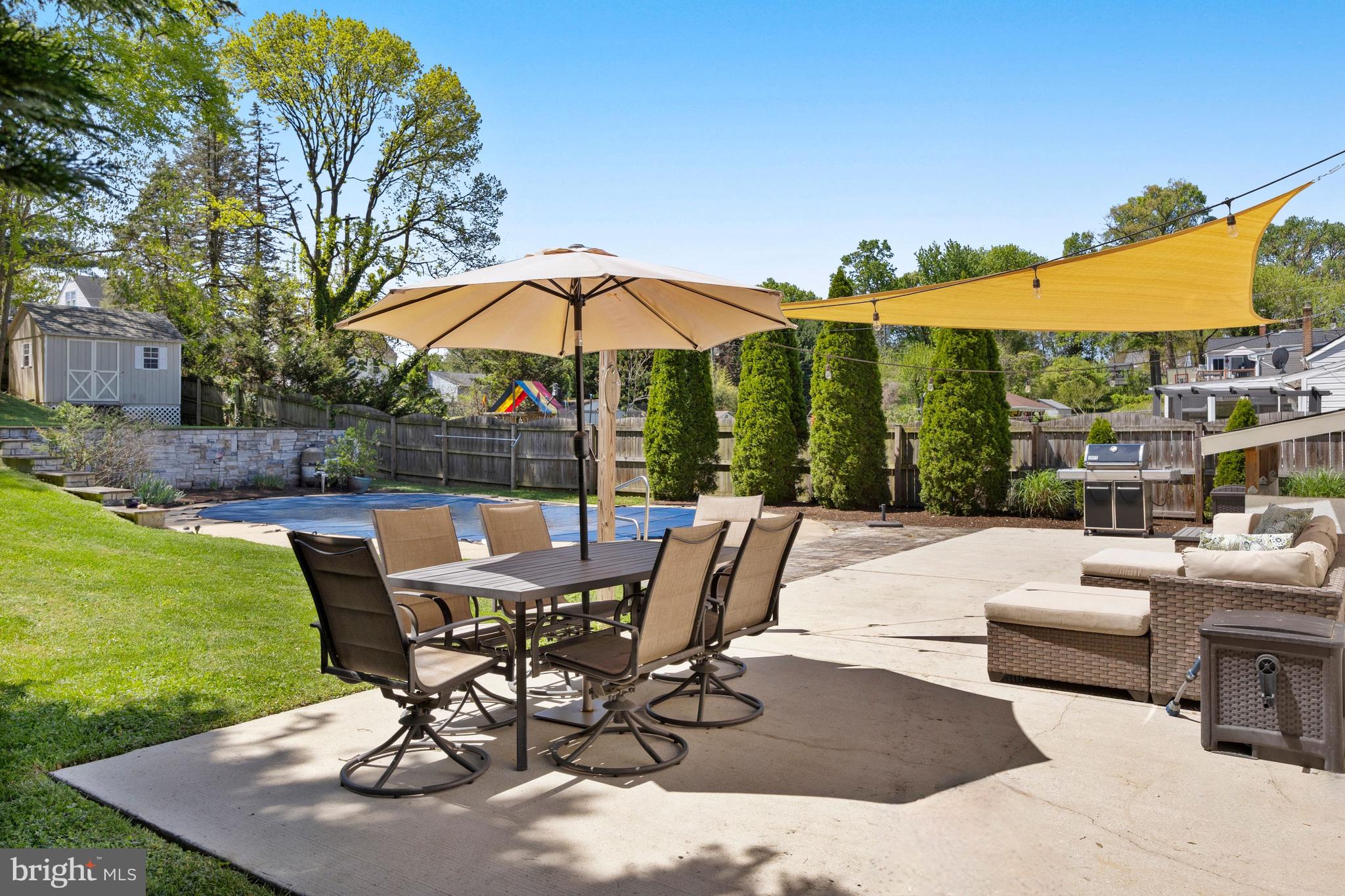 511 Greenwood Road Linthicum Heights, MD 21090 - Photo 18 of 26 a view of a patio with a table chairs and a table