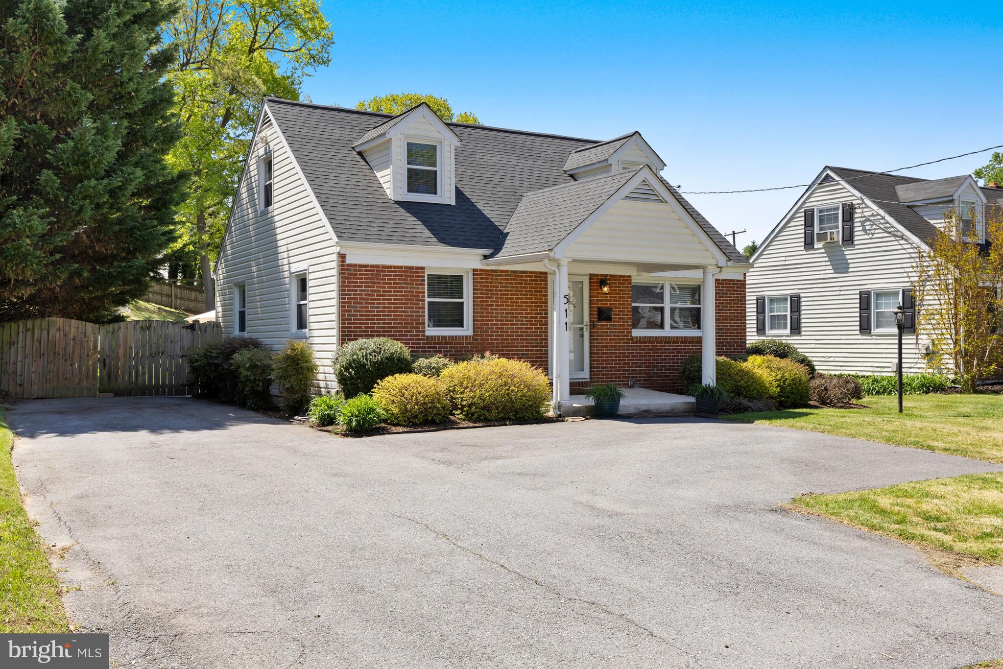 511 Greenwood Road Linthicum Heights, MD 21090 - Photo 22 of 26 a front view of a house with a yard and garage