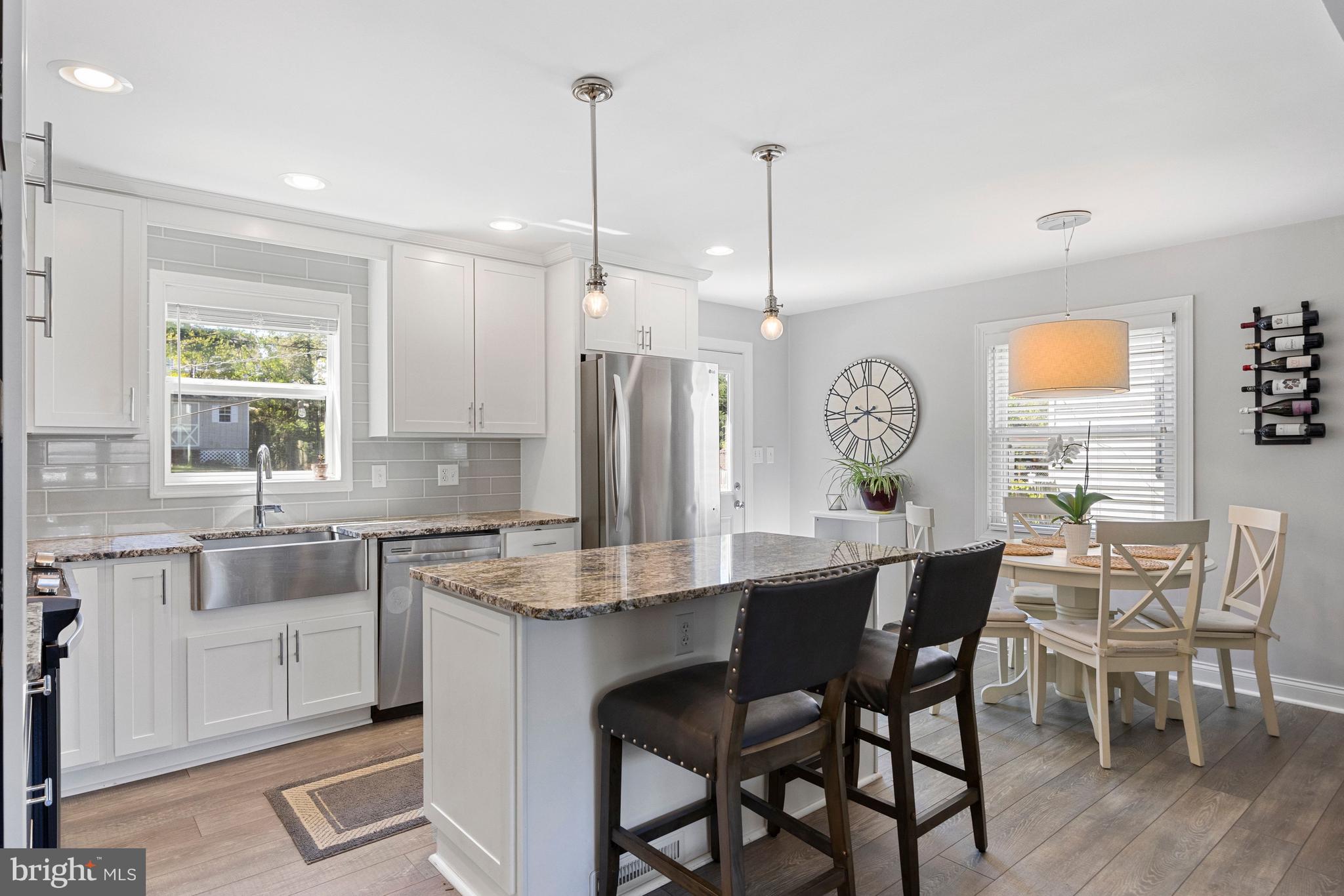 511 Greenwood Road Linthicum Heights, MD 21090 - Photo 3 of 26 a large kitchen with a table and chairs in it