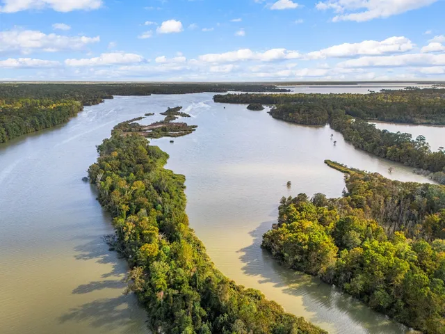 a aerial view of a house with a yard basket ball court and outdoor seating