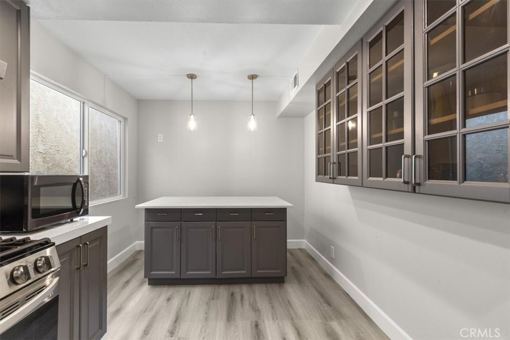 1353 Termino Avenue Long Beach, CA 90804 - Photo 12 of 33 a view of a kitchen with furniture and wooden floor