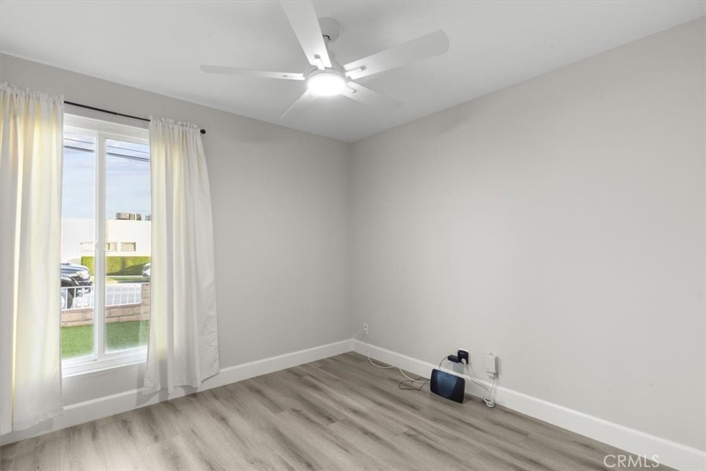 1353 Termino Avenue Long Beach, CA 90804 - Photo 17 of 33 an empty room with a window and wooden floor