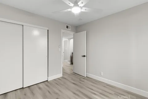 a view of room with wooden floor