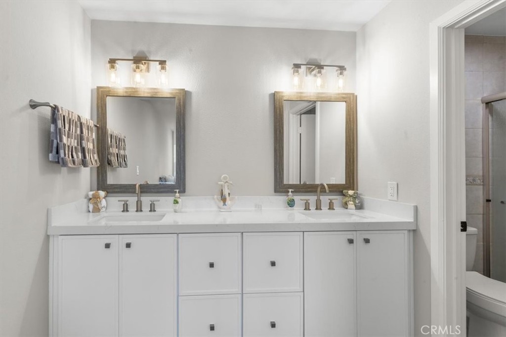 1353 Termino Avenue Long Beach, CA 90804 - Photo 28 of 33 a bathroom with double vanity sinks and a mirror