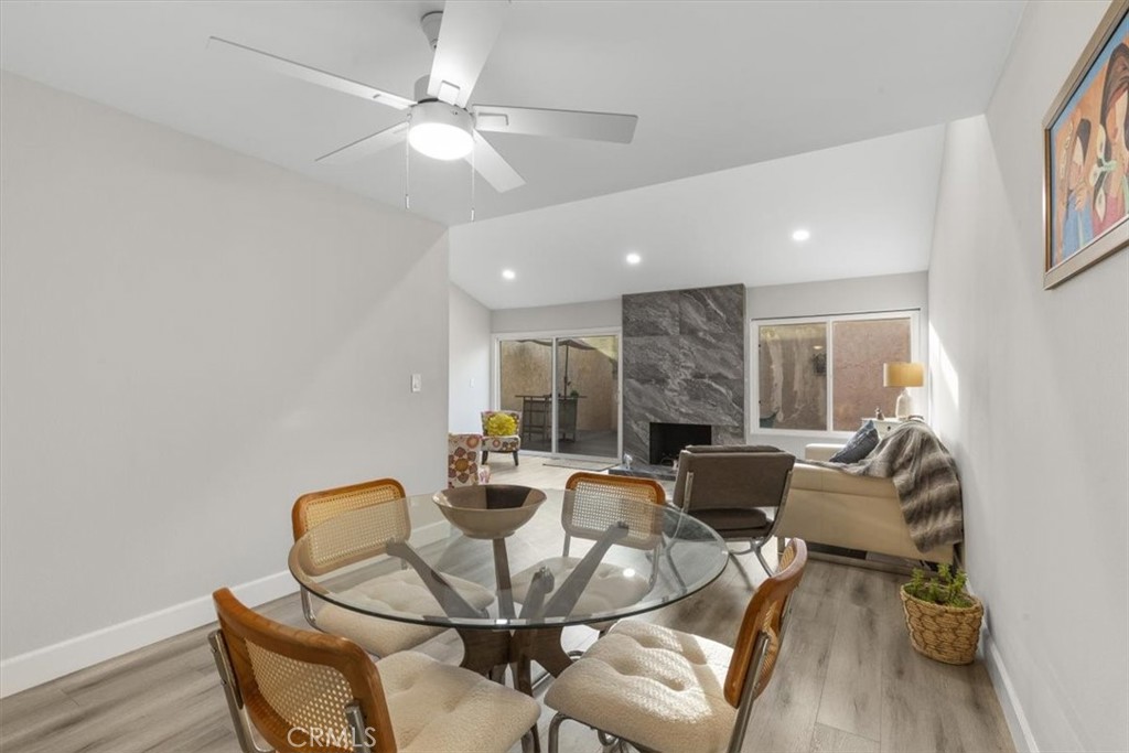 1353 Termino Avenue Long Beach, CA 90804 - Photo 3 of 33 a dining room with furniture and a chandelier fan