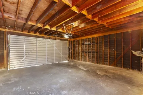 a view of empty room with wooden walls
