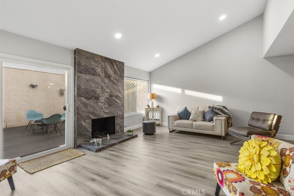 1353 Termino Avenue Long Beach, CA 90804 - Photo 6 of 33 a living room with furniture and a fireplace