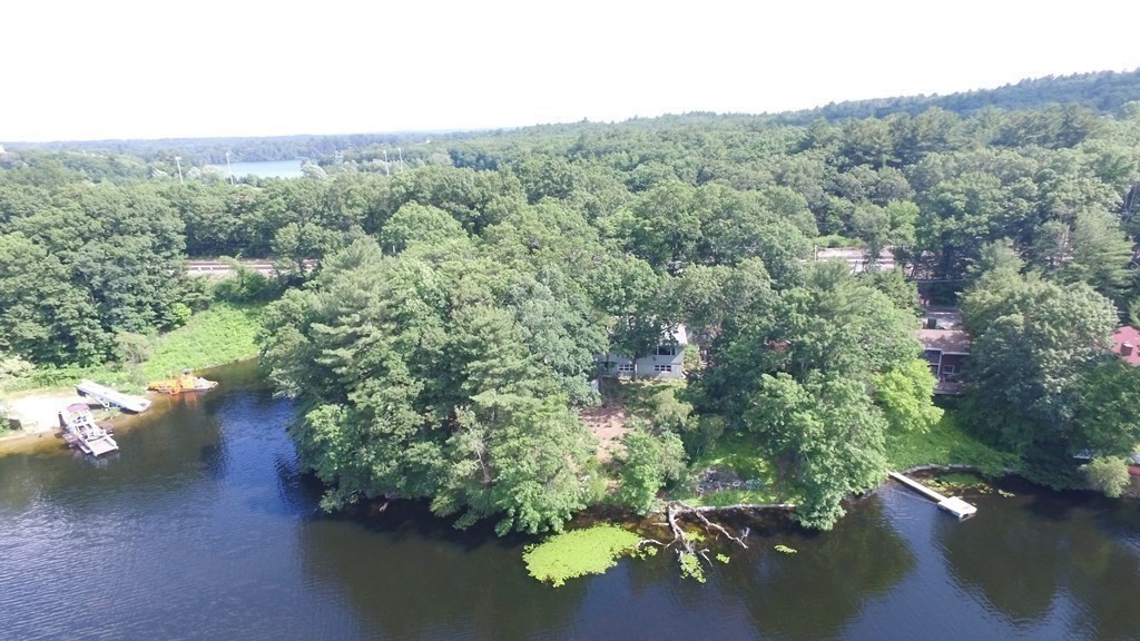 3 Bacon Street Wellesley, MA 02482 - Photo 4 of 7 a view of a street with a forest