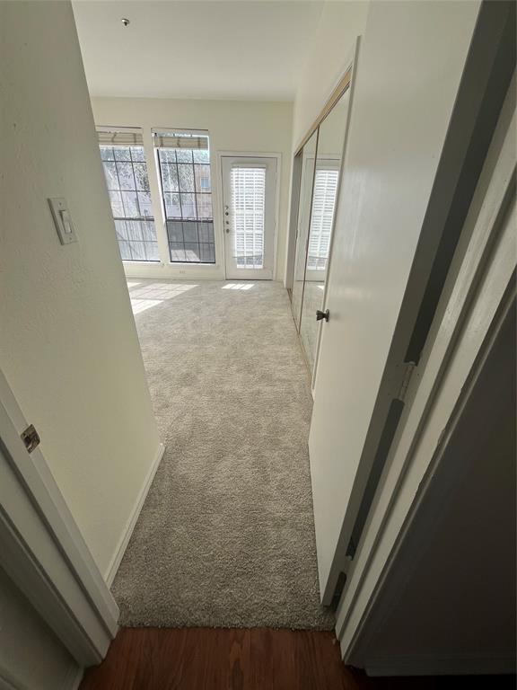 3817 Gilbert Avenue, Unit 107 Dallas, TX 75219 - Photo 4 of 6 a view of entryway with wooden floor